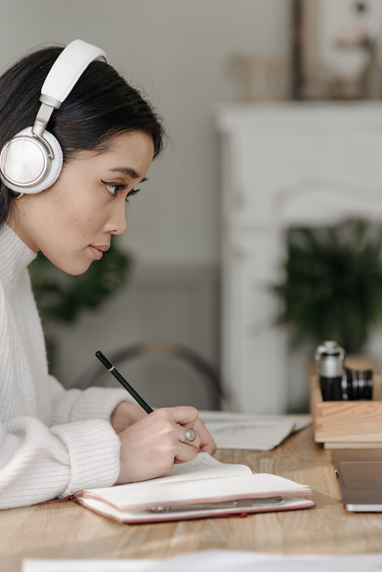 Young Woman on Head Phone Studying